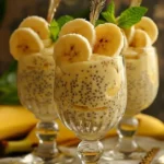 Delicious banana chia pudding in a bowl topped with fresh bananas and chia seeds