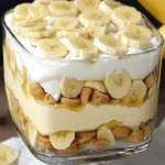 Delicious homemade banana pudding served in a bowl with vanilla wafers and bananas.
