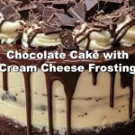 Delicious chocolate cake with cream cheese frosting on a white plate