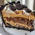 Delicious Chocolate Peanut Butter Pie topped with chocolate shavings and peanut butter fill