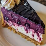 Easy Blueberry Velvet Cheesecake topped with fresh blueberries and a velvety cream layer