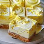 Elegant lemon marbled cheesecake bars with a creamy and vibrant lemon swirl.