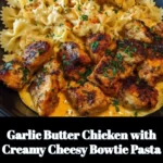 Garlic Butter Chicken with creamy cheesy bowtie pasta on a plate