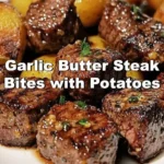 Garlic Butter Steak Bites served with crispy potatoes on a plate