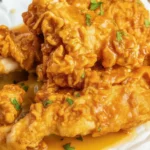 Air Fryer Honey Butter Garlic Chicken Tenders served hot with a side dish.