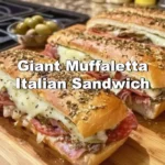Giant Muffaletta Italian Sandwich with meats, cheese, and olive salad