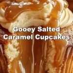 Delicious gooey salted caramel cupcakes topped with creamy frosting.