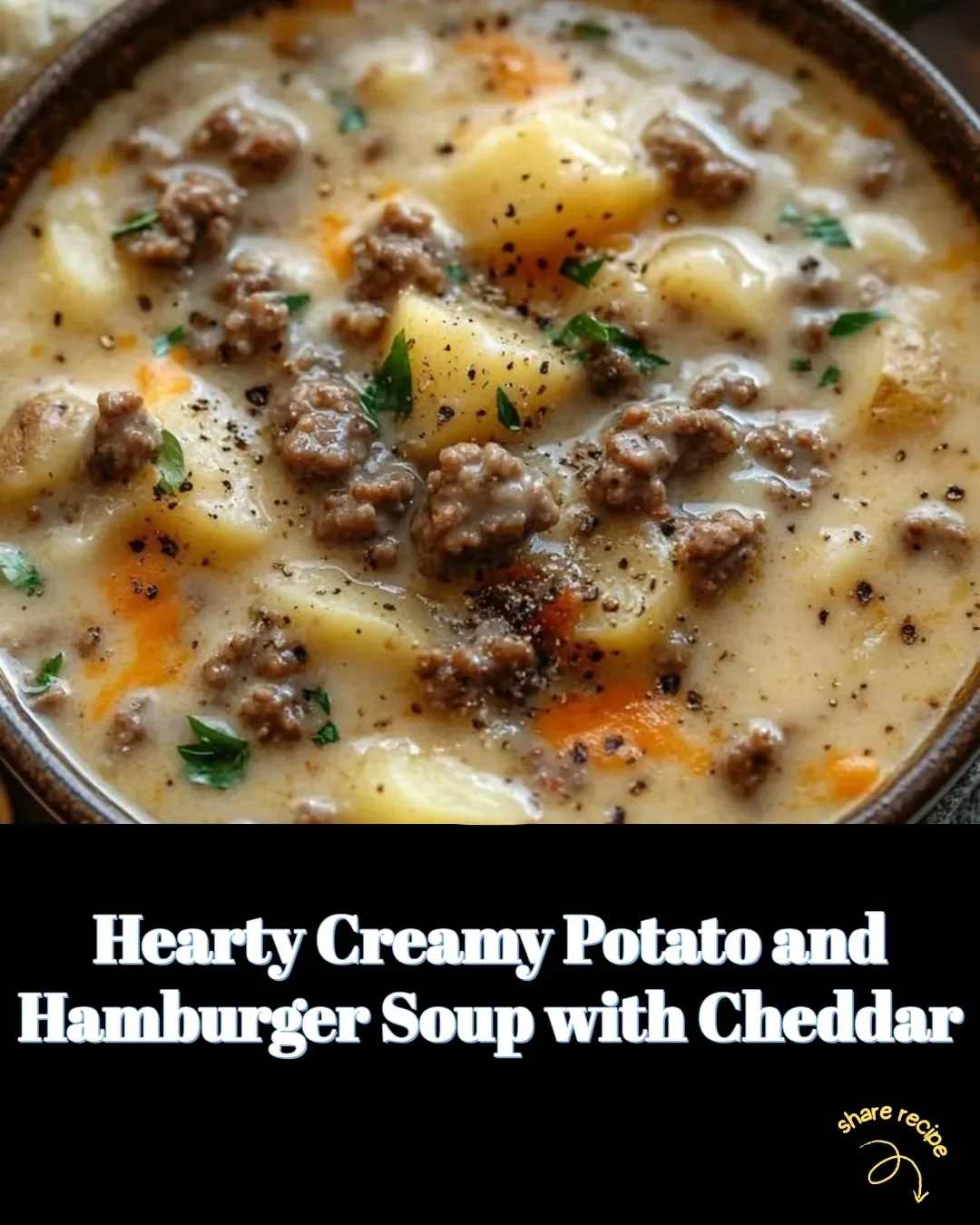 Hearty creamy potato and hamburger soup topped with cheddar cheese in a bowl.