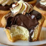 Delicious Boston Cream Pie Cupcakes topped with chocolate ganache.