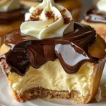 Delicious Boston Cream Pie Cupcakes topped with chocolate and custard filling