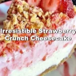 Delicious strawberry crunch cheesecake topped with strawberry pieces and crunch
