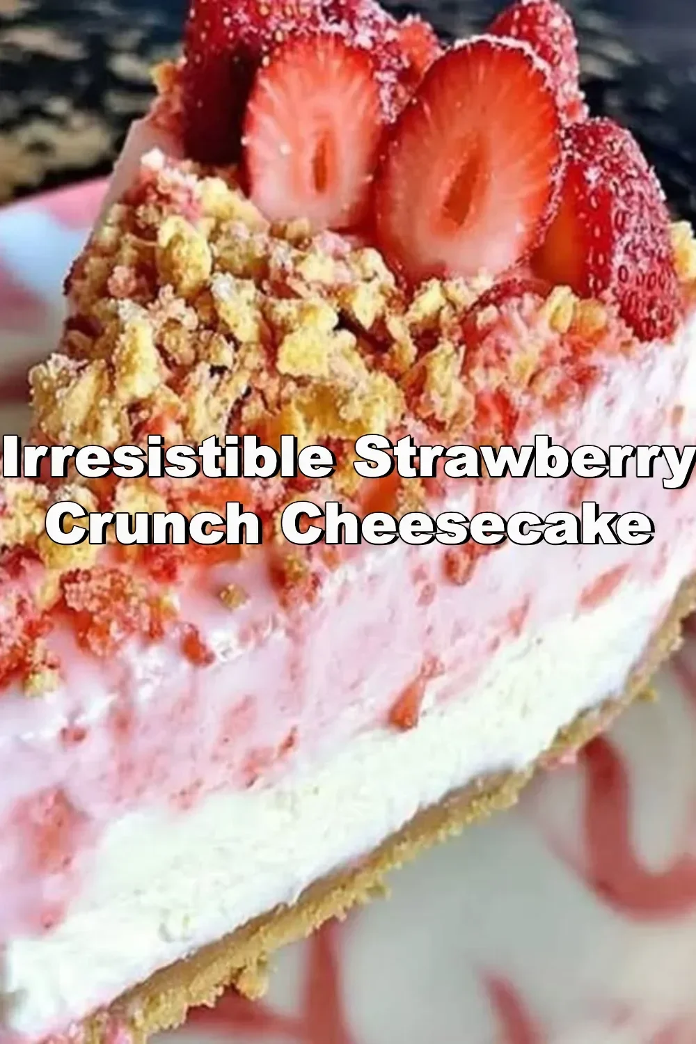 Delicious strawberry crunch cheesecake topped with strawberry pieces and crunch