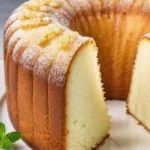 Slice of delicious Lemon-Lime Pound Cake topped with citrus glaze.