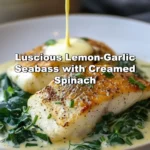 Lemon-garlic seabass served with creamed spinach on a dinner plate.
