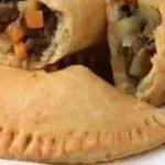 Delicious homemade meat pie with golden crust and savory filling