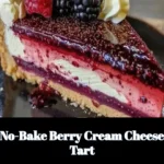 No-bake berry cream cheese tart topped with fresh berries on a crust.