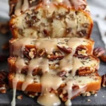 Delicious Pecan Praline Buttermilk Loaf Cake with a rich topping