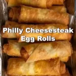 Philly Cheesesteak egg rolls filled with cheese, steak, and peppers.