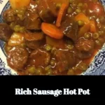 Delicious rich sausage hot pot served in a traditional pot with fresh ingredients.