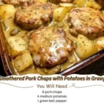 Smothered pork chops served with potatoes in rich gravy