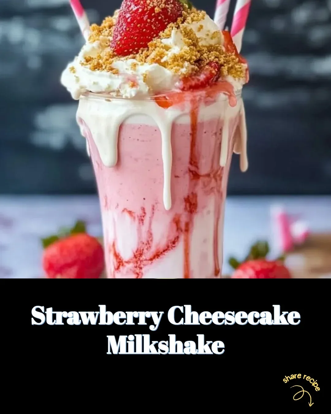 Strawberry cheesecake milkshake topped with whipped cream and fresh strawberries.