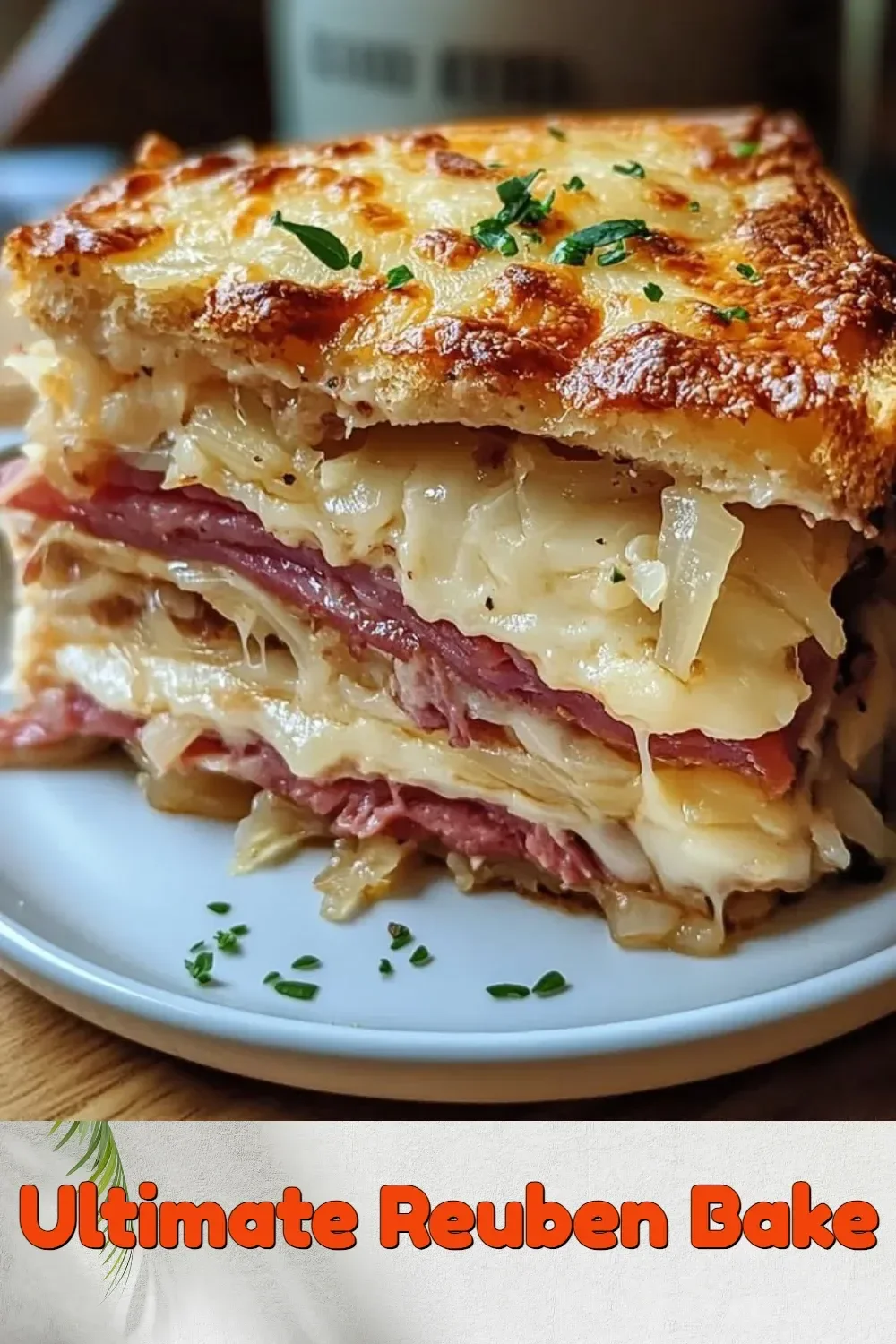 Ultimate Reuben Bake featuring layers of corned beef, sauerkraut, and Swiss cheese.