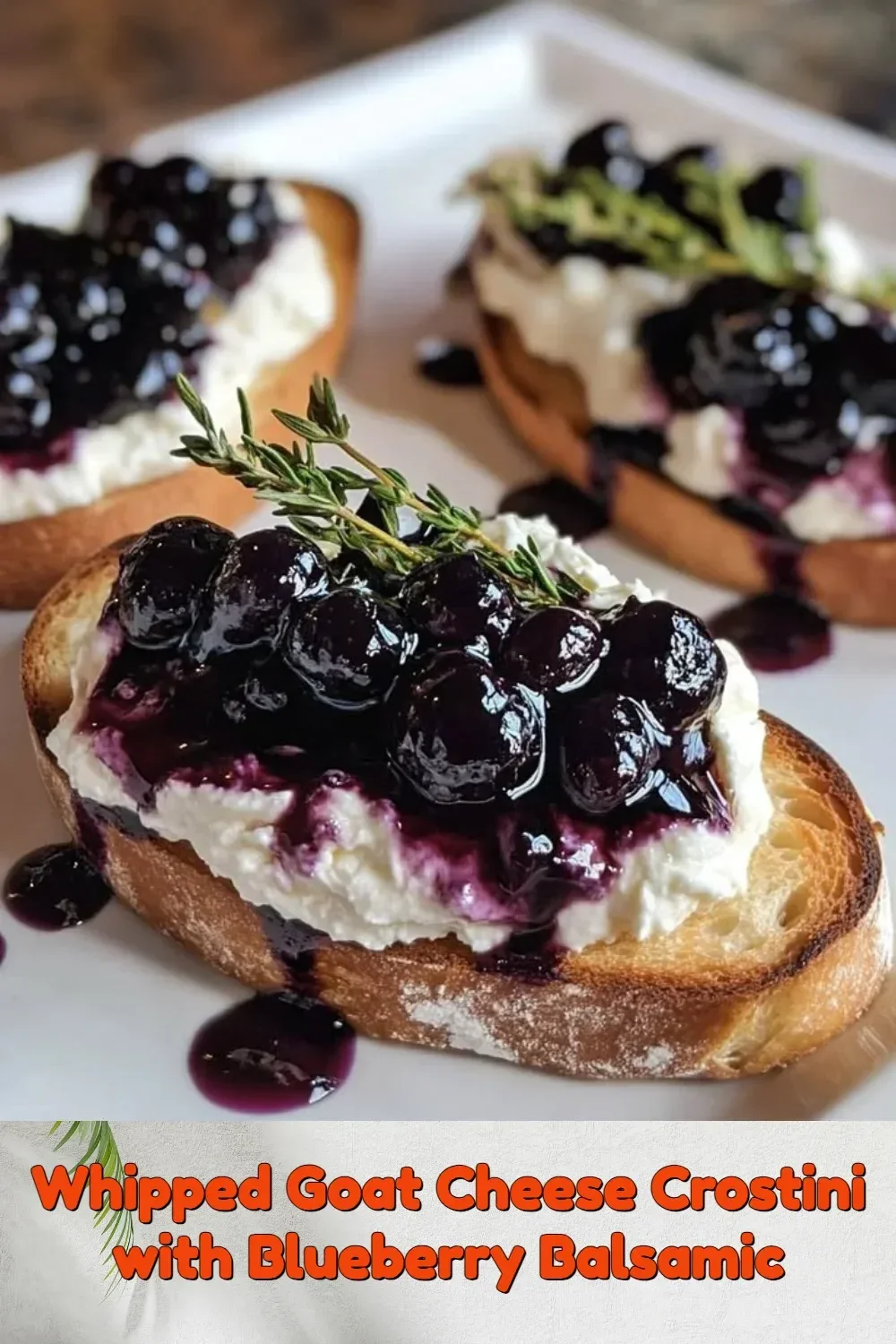 Whipped goat cheese crostini topped with blueberry balsamic glaze