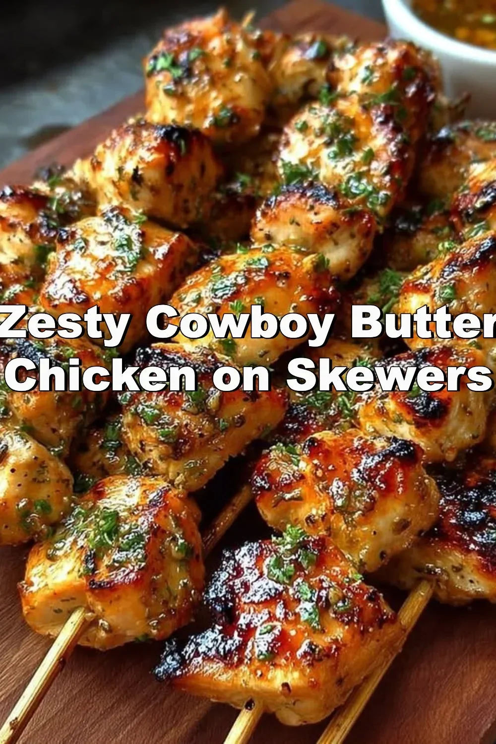 Skewers of zesty cowboy butter chicken with vibrant seasoning and herbs
