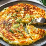 Delicious cabbage pancake served on a plate with dipping sauce