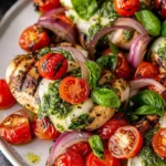 Caprese Grilled Chicken topped with fresh mozzarella, tomatoes, and basil