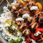 Grilled chicken skewers with charred peppers and herbaceous vinaigrette