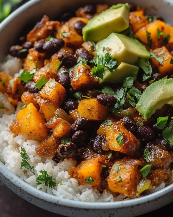 Chipotle roasted butternut squash and black bean bake served in a dish.