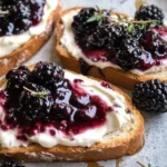 Freshly made Blackberry Thyme Toast with Greek yogurt and honey drizzle