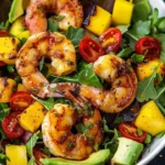 Delicious grilled shrimp salad with fresh greens and cherry tomatoes