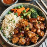 Delicious Hibachi Chicken grilled to perfection with vegetables and sauce.