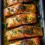 Honey Garlic Butter Baked Salmon served with vegetables