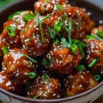 Delicious Korean meatballs drizzled with apricot glaze on a plate