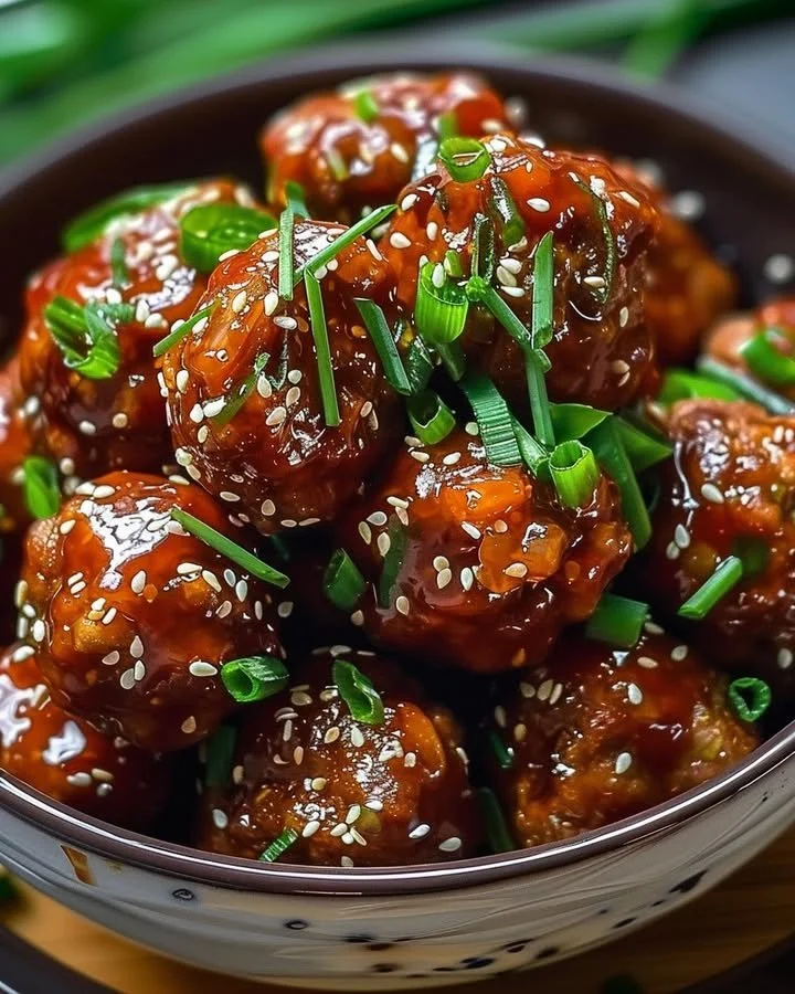 Delicious Korean meatballs drizzled with apricot glaze on a plate