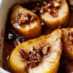 Delicious maple-spiced baked pears topped with nuts and spices