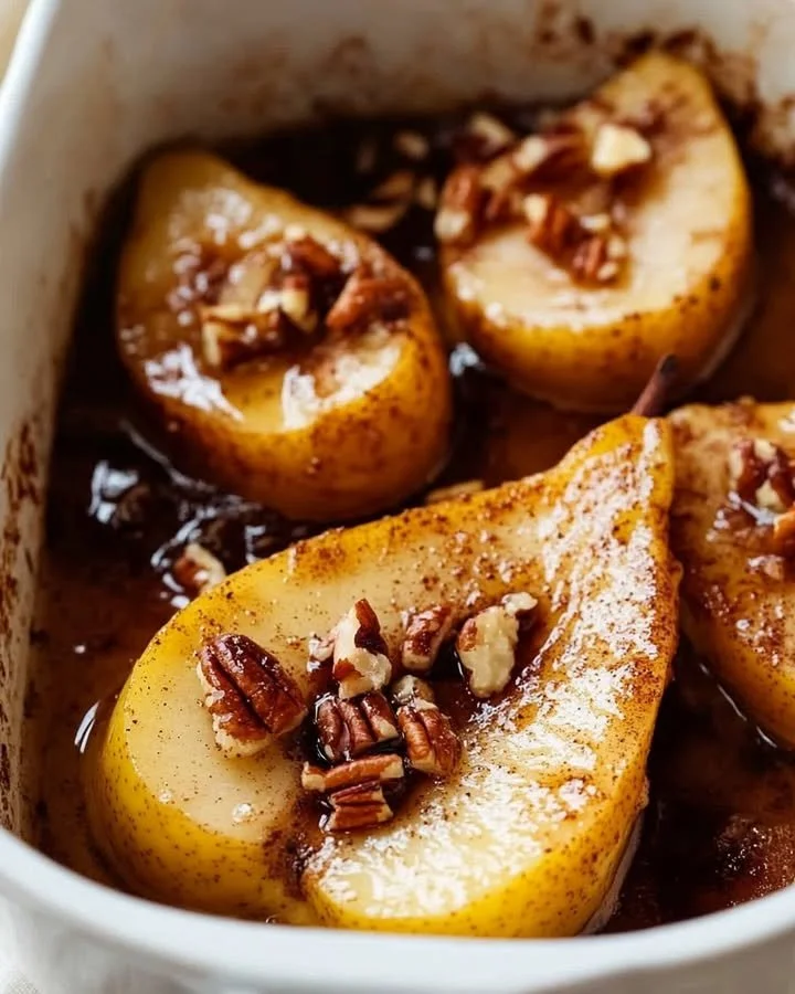 Delicious maple-spiced baked pears topped with nuts and spices