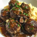 Meatballs served in a creamy mushroom sauce on a plate