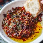 Mediterranean olive oil dip served with fresh bread and herbs