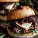 Delicious short rib sliders with balsamic cranberry sauce served on a plate
