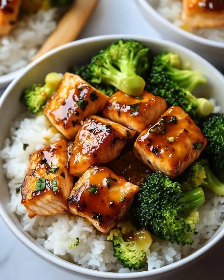Orange Ginger Salmon Bowls featuring fresh salmon, vegetables, and ginger sauce