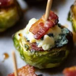 Roasted Brussels sprouts topped with blue cheese and bacon bites