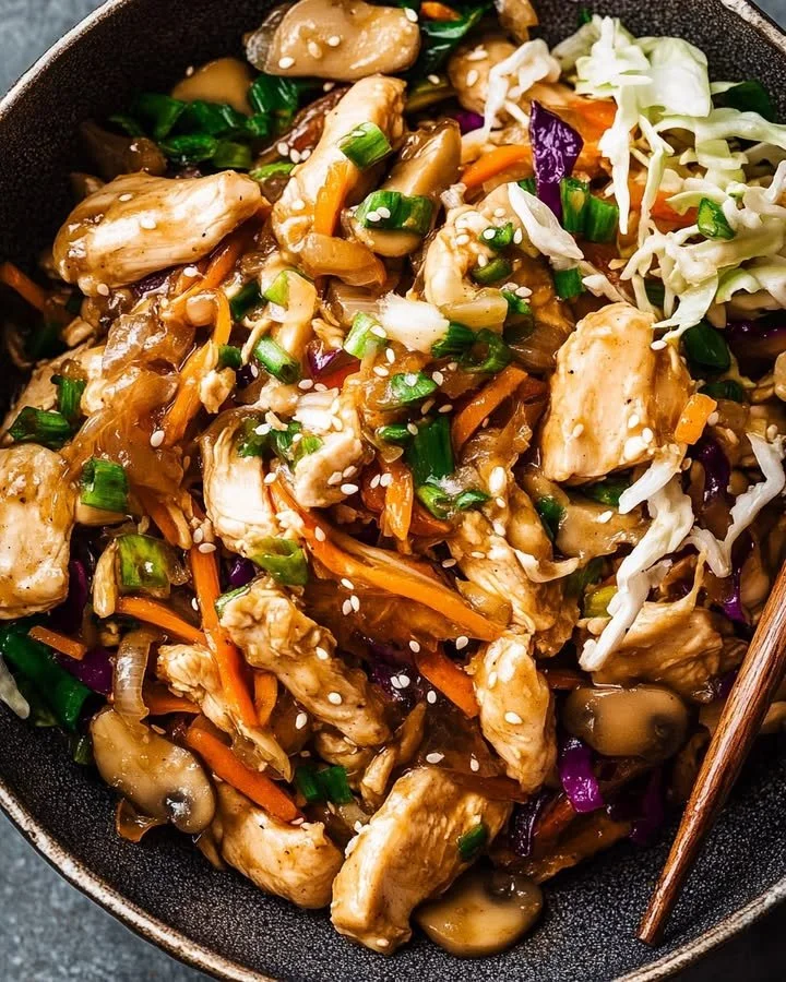 Sesame-Ginger Chicken stir-fry with colorful vegetables on a plate