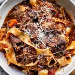 A bowl of delicious Short Rib Ragu served with pasta.