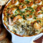 Creamy shrimp and crab spinach dip served with crackers and fresh vegetables