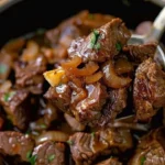 Succulent slow-cooked sirloin bites served in a savory sauce.