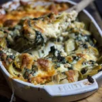 Cheesy turkey artichoke bake dish, golden and appetizing, ready to serve.